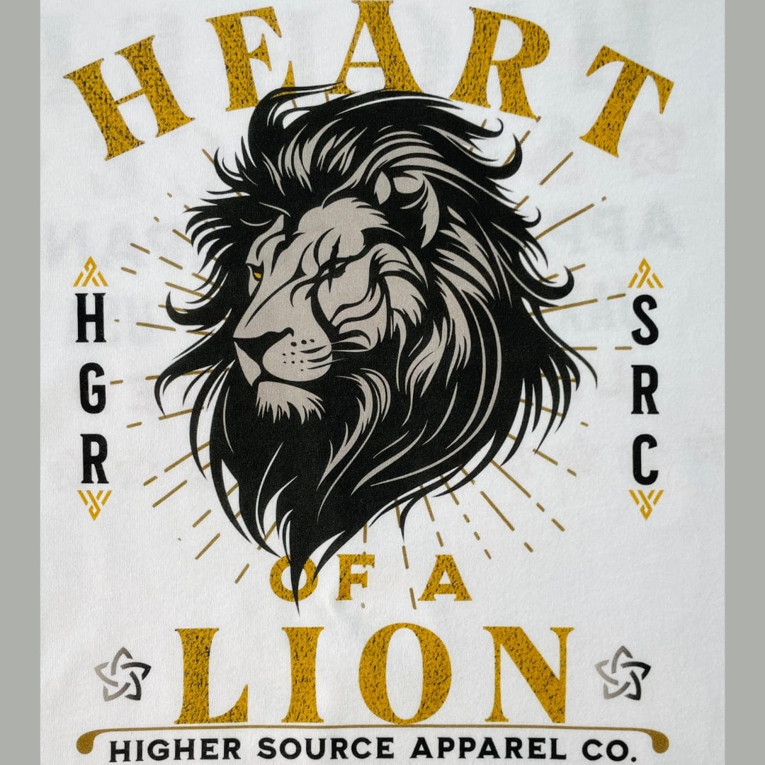 A close up of a large lion's head on the front of a white higher source apparel t shirt