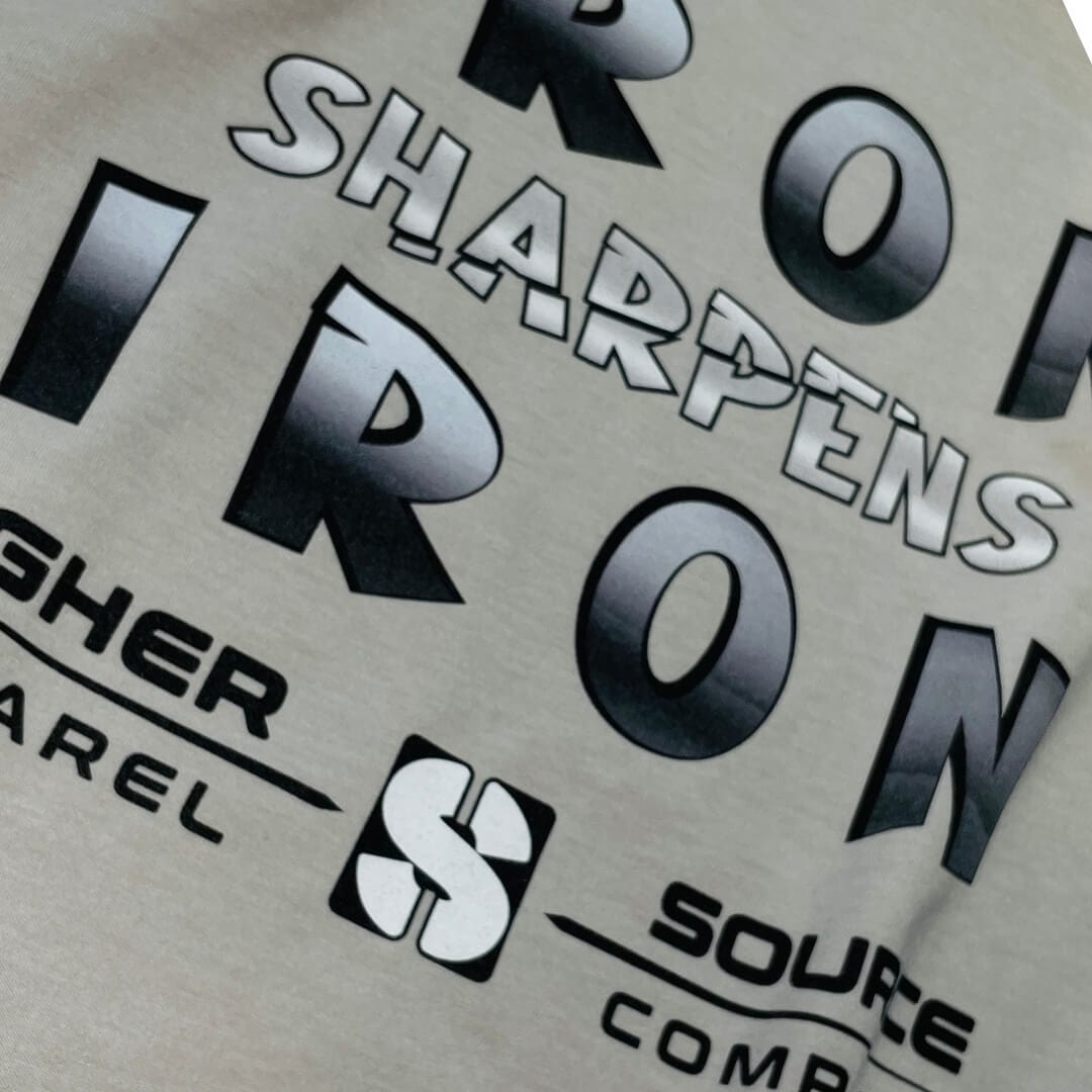 Iron sharpens iron in large black and american silver font. Higher source apparel company is written in black font below