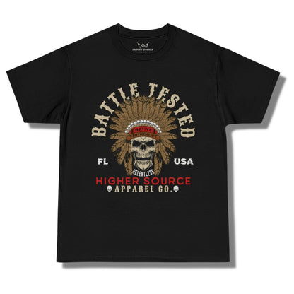 Front side of a black higher source apparel oversized t shirt with battle tested in large dark vanilla font and an apache skull in the center. Higher Source apparel company is at the bottom in red and dark vanilla font.