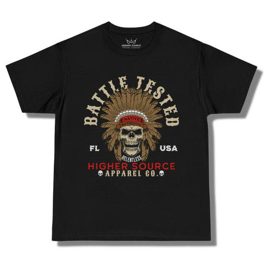 Front side of a black higher source apparel oversized t shirt with battle tested in large dark vanilla font and an apache skull in the center. Higher Source apparel company is at the bottom in red and dark vanilla font.