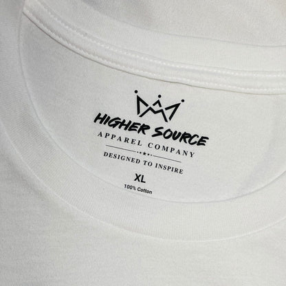 A close up of a higher source neck tag and collar. The label says designed to inspire in black font