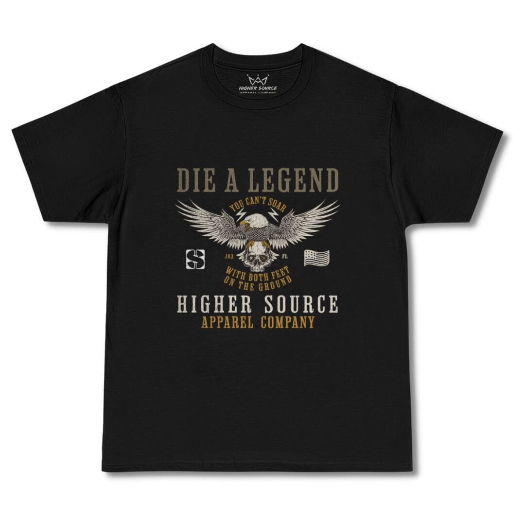 Front side of a black oversized higher source apparel t shirt with an eagle resting on a skull. Die a legend is in bold font above the eagle and higher source apparel company is printed below. You can’t soar with both feet on the ground is in smaller font surrounding the eagle.