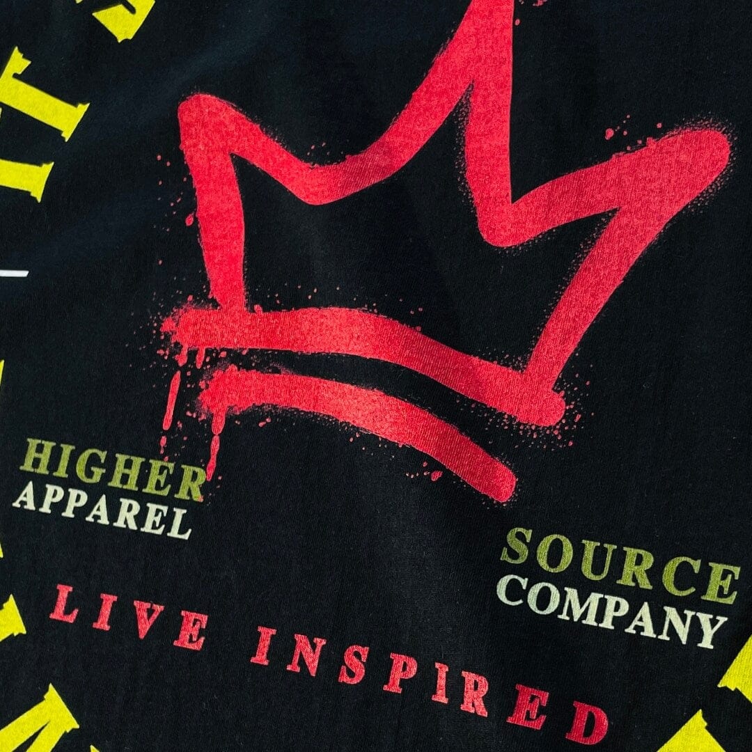 A rosso corsa red crown with higher source apparel company in sage and soldier green font. Live inspired is also in red font.  Higher source logo with the letter H and a flame in the center. Live Inspired is written in maximum yellow font.