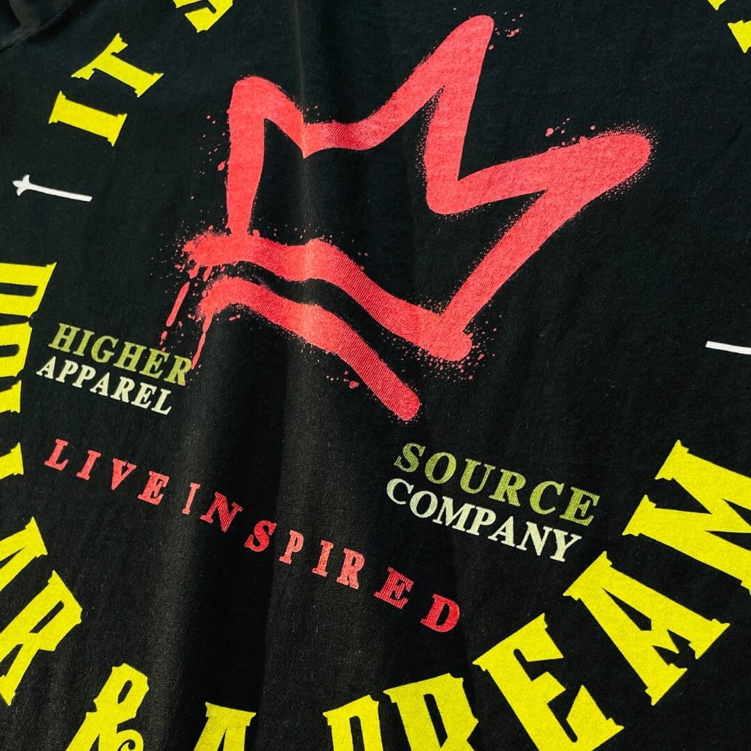 A rosso corsa red crown with higher source apparel company in sage and soldier green font. Live inspired is also in red font.  Higher source logo with the letter H and a flame in the center. Live Inspired is written in maximum yellow font.