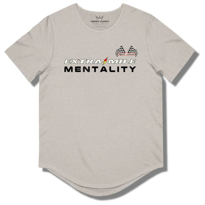 Front side of a heather cool grey curved hem t shirt with “extra mile mentality” in white and black font. A red and yellow lightning bolt separates the word extra and mile. The higher source logo is in the upper left breast area in black font with dual checkered flags.