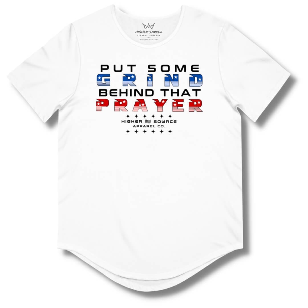 Front side of a white higher source apparel curved hem t shirt with “put some grind behind that prayer” in red black and blue font.