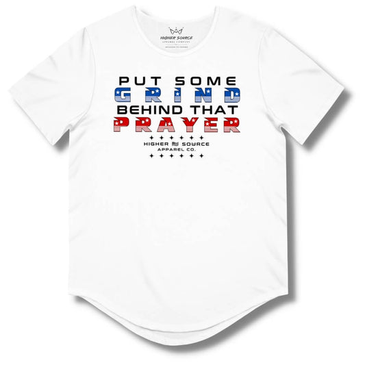 Front side of a white higher source apparel curved hem t shirt with “put some grind behind that prayer” in red black and blue font.