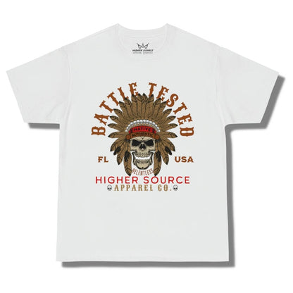 Front side of a white oversized higher source apparel t shirt with battle tested in large brown font and an apache skull in the center. Higher Source apparel company is at the bottom in red and dark vanilla font.