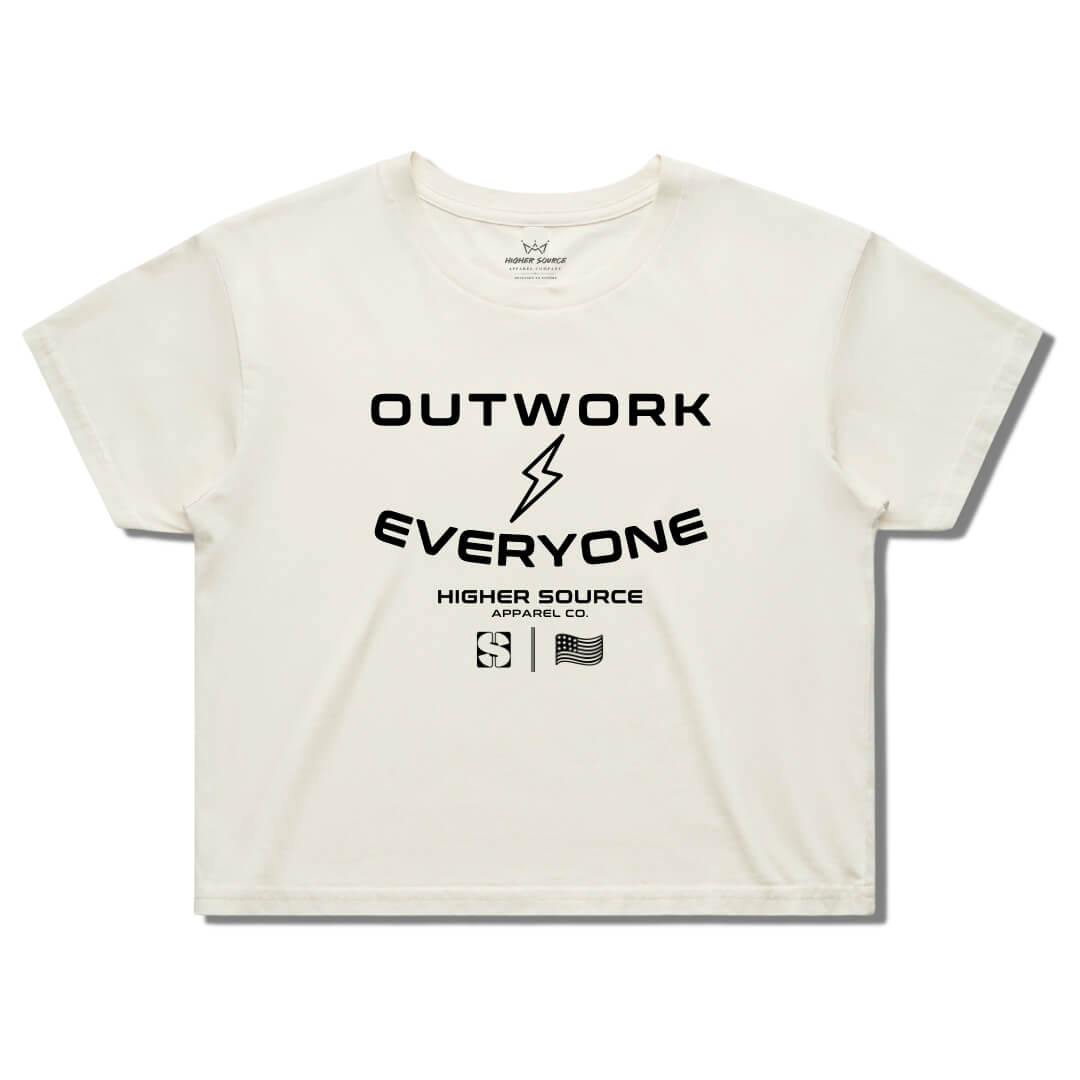 Front side of a women's ecru higher source apparel streetwear crop tee. Outwork everyone is in large black font surrounding a black lightening bolt. Higher source apparel company is below in smaller black font along with the higher source HS logo and an abstract american flag.
