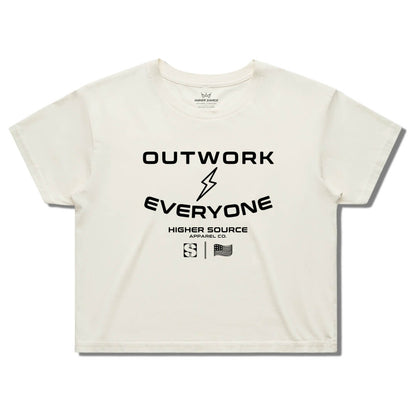 Front side of a women's ecru higher source apparel streetwear crop tee. Outwork everyone is in large black font surrounding a black lightening bolt. Higher source apparel company is below in smaller black font along with the higher source HS logo and an abstract american flag.