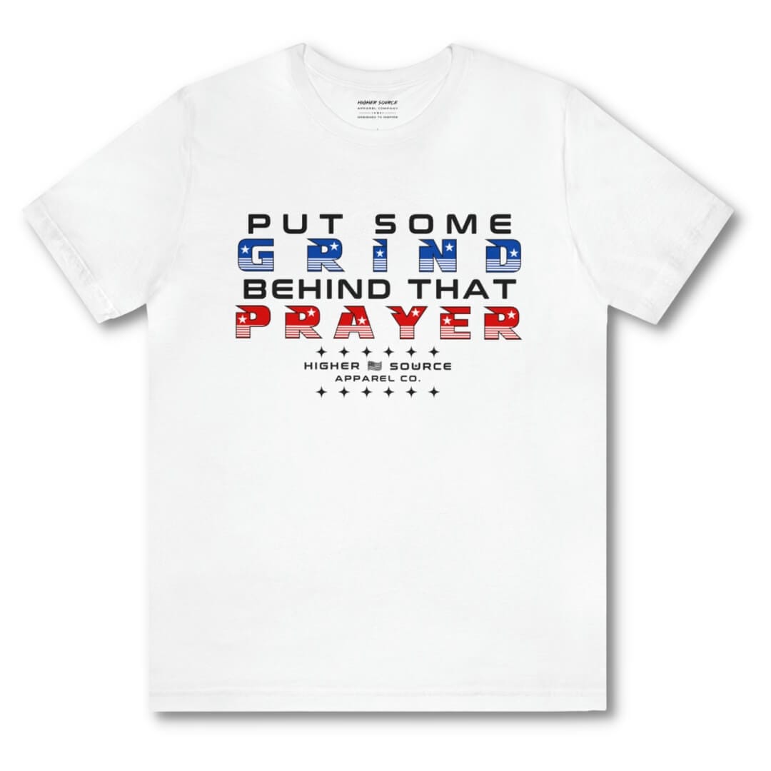 Front side of a white higher source apparel women’s t shirt with “put some grind behind that prayer” in rosso corsa red, black and blue font. The higher source logo is below in black font.