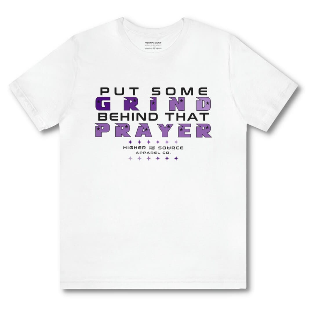 Front side of a white higher source apparel women’s t shirt with “put some grind behind that prayer” in black, and metallic violet font. The higher source logo is below in black font. 