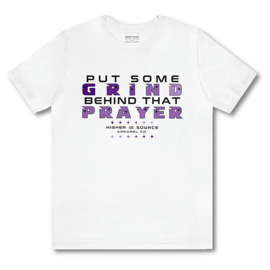 Front side of a white higher source apparel women’s t shirt with “put some grind behind that prayer” in black, and metallic violet font. The higher source logo is below in black font. 